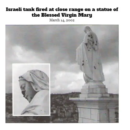 070_Israeli-tank-fired-at-close-range-on-a-statue-of-Mary